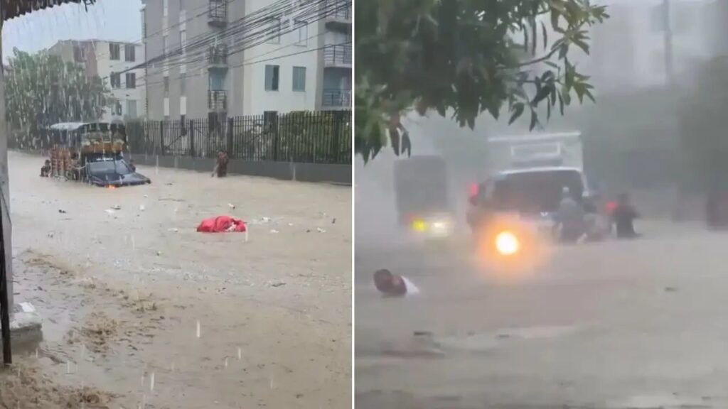 Alerta roja en Santa Marta por lluvias: calles inundadas con vehículos varados y un vecino en medio del agua en la capital del Magdalena